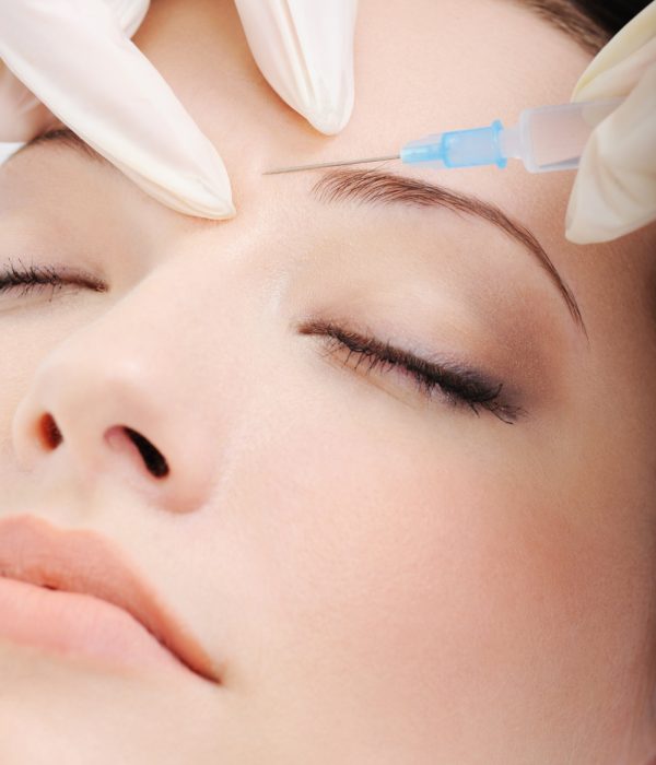 cosmetic-injection-of-botox-to-the-pretty-female-face-close-up-portrait