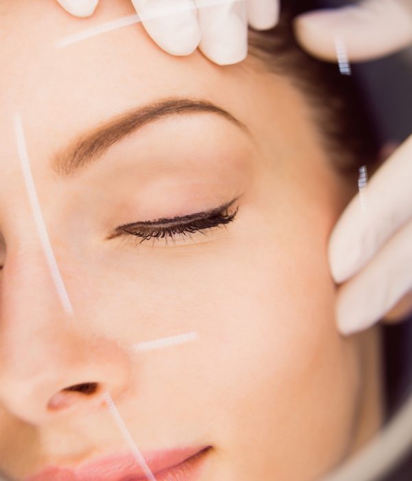 dermatologist-examining-female-patient-skin